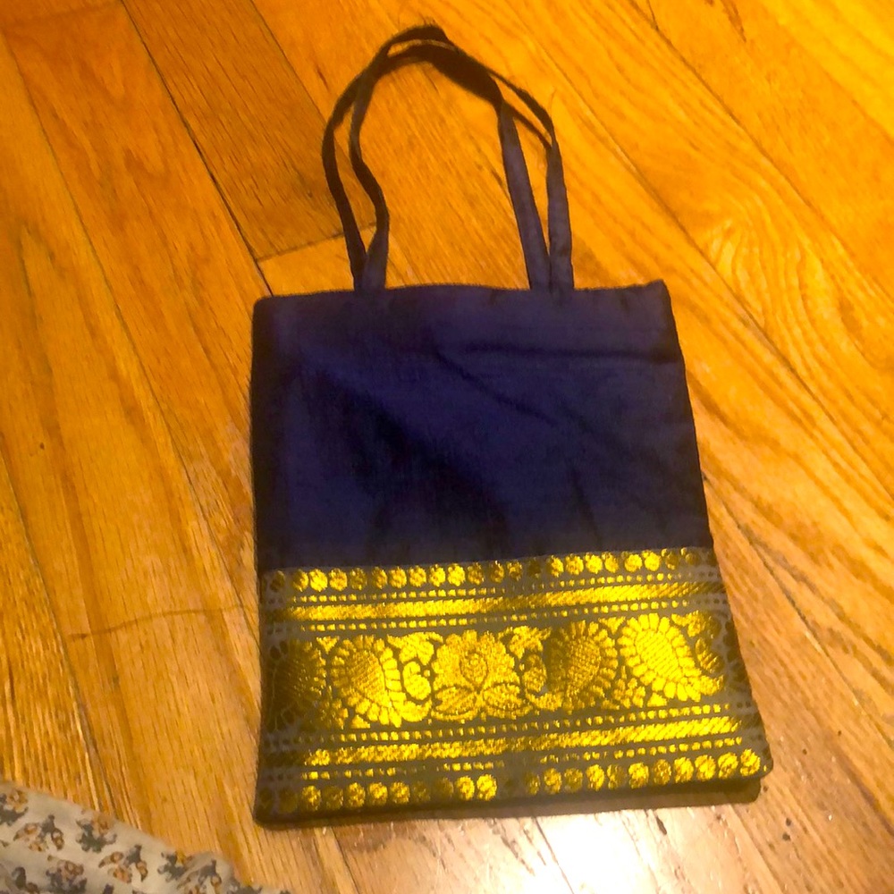Small evening silk bag with golden border very light weight